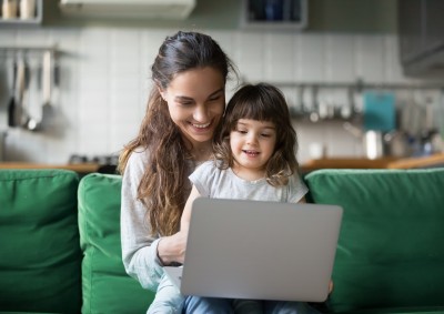 Mum and daughter looking at laptop