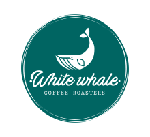 White Whale Coffee Roasters Logo - a white whale above the writing 'white whale coffee roasters' on a teal round background