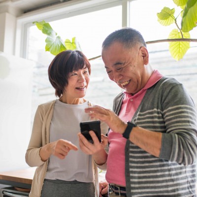 Residents using iPad standing by window