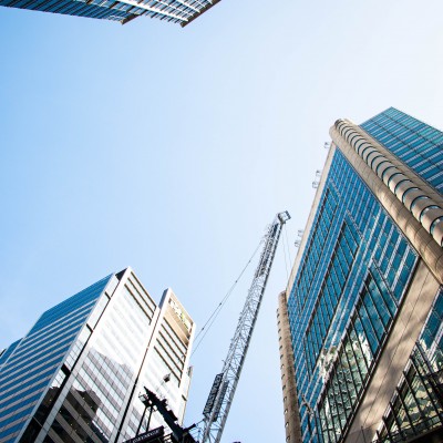 Sydney city office buildings with crane, from below